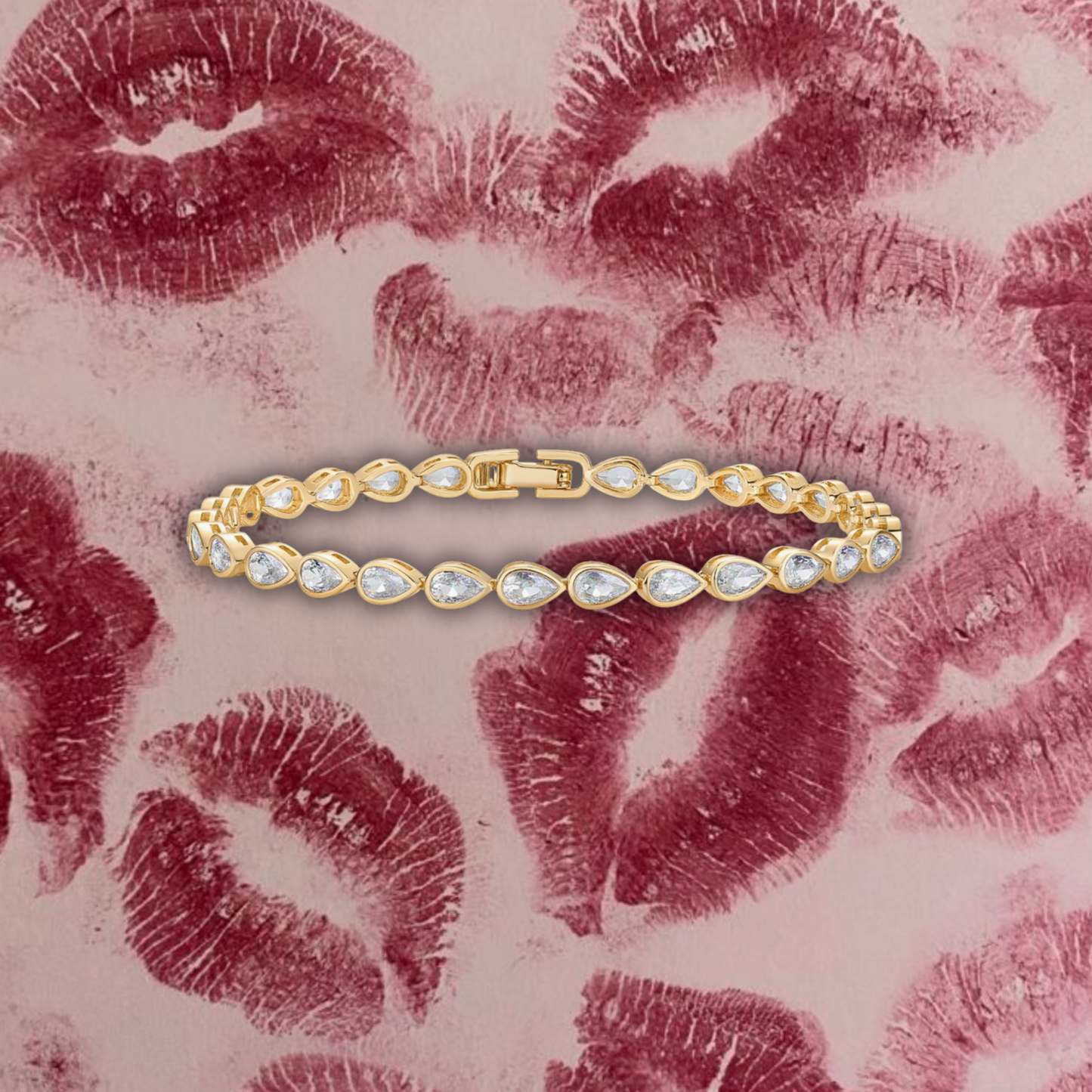 Gold bracelet with clear stones on a background with red lipstick prints